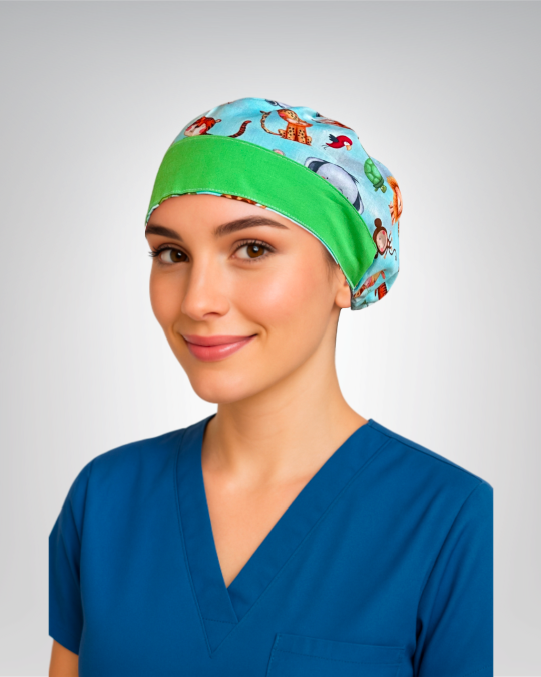 European style scrub cap with blue background with white clouds and playful safari animals like lions, tigers, and elephants, with green trim
