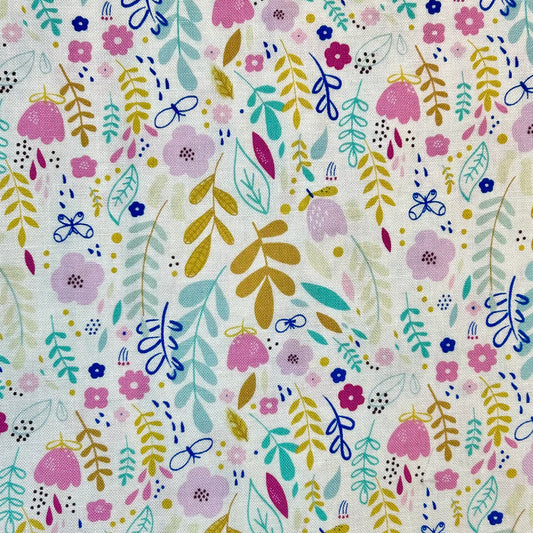 Scrub cap print with gold, turquoise, and pink flowers and leaves on a white background