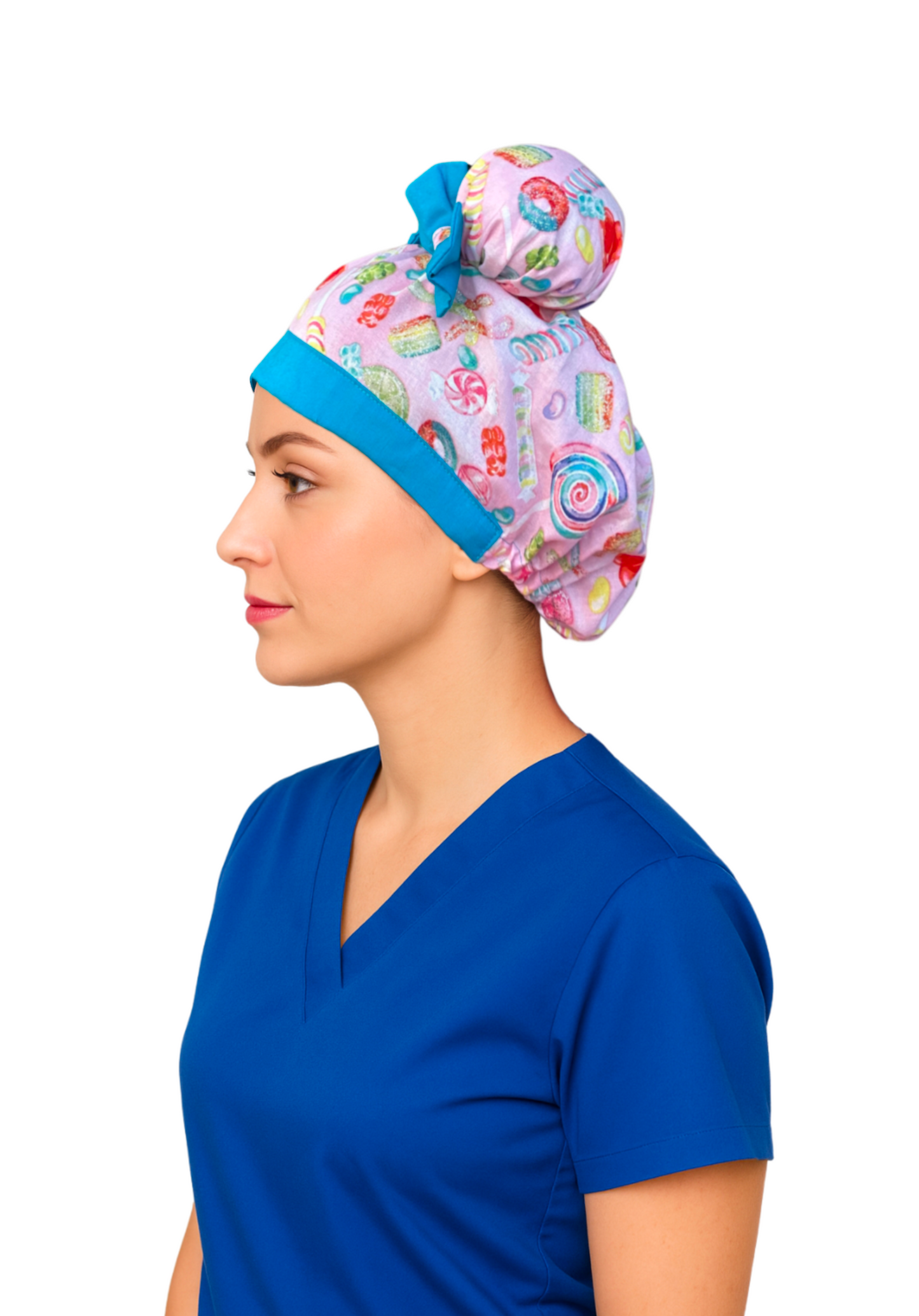 Side view of nurse wearing Sugar Pop ScruBunz with pink candy print, sky blue trim, and two space buns visible from the side