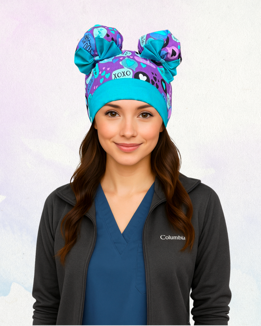 ScruBunz scrub cap with purple base and playful blue and turquoise text bubble print