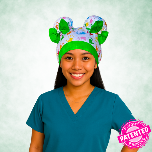 Happy Hands ScruBunz - fearturing Colorful Baby Handprint Pattern with Green Accents on white background