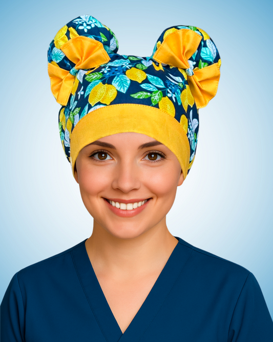 ScruBunz scrub cap with two space buns, blue background, green leaves, and yellow lemons