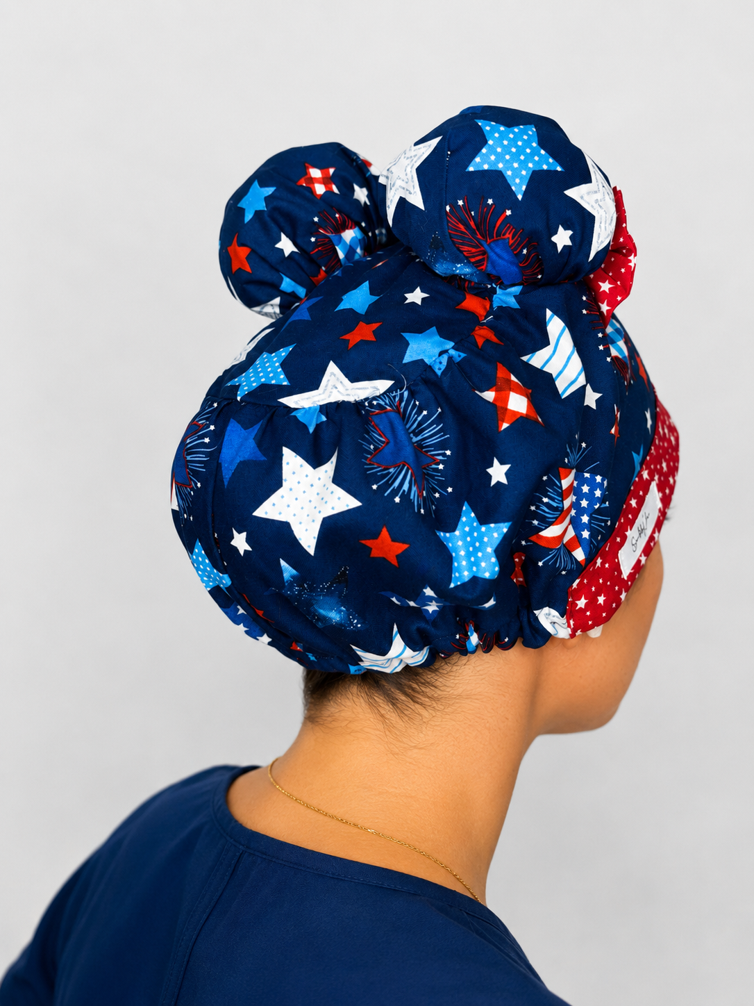Star Spangled Sweetie ScruBunz – Patriotic Scrub Cap for Nurses with Removable Buns & Red White Blue Firework Print