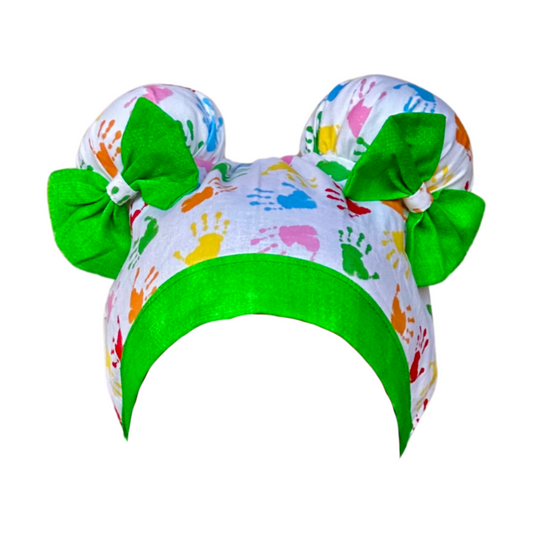 Happy Hands ScruBunz - fearturing Colorful Baby Handprint Pattern with Green Accents on white background