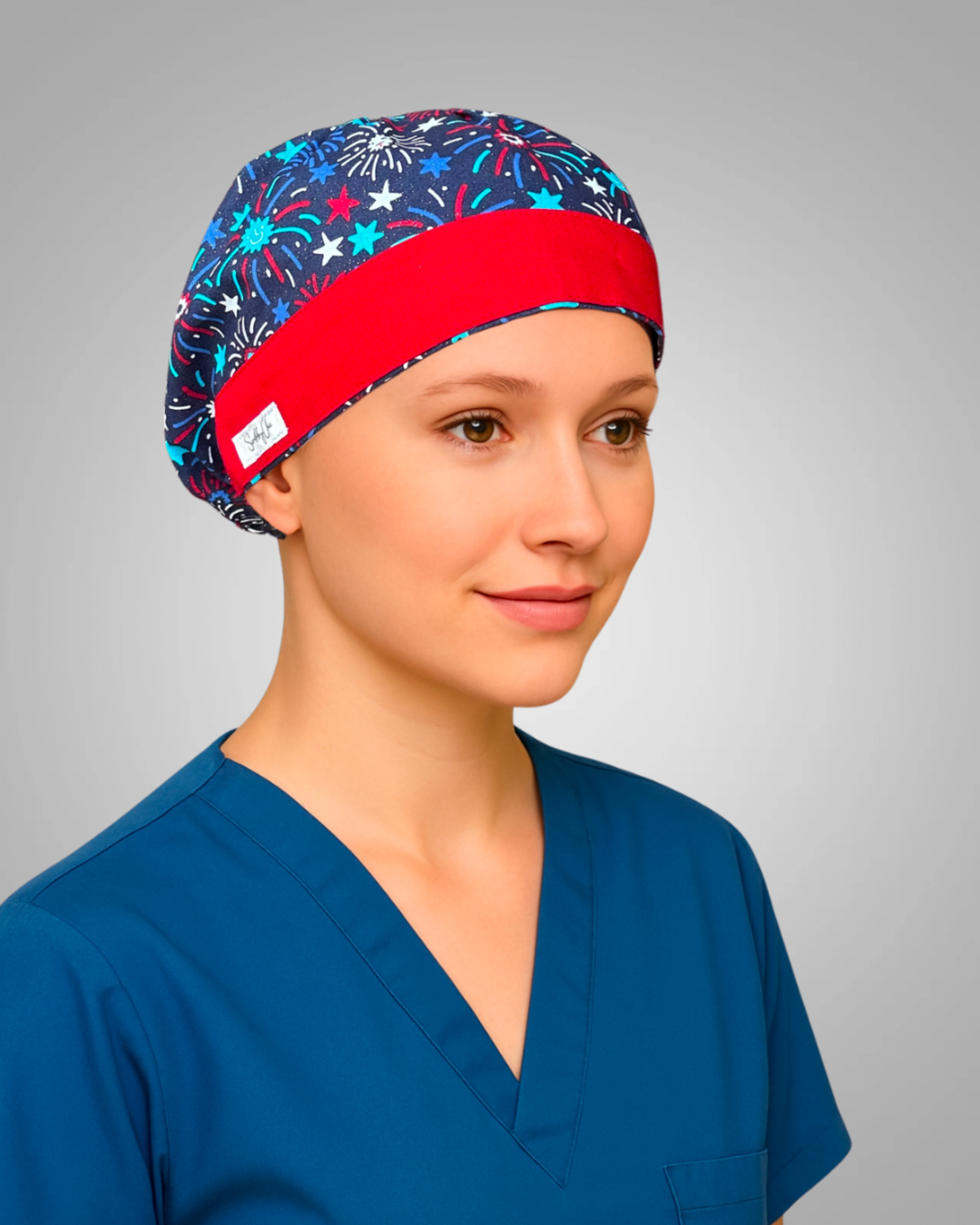 Traditional European scrub cap with red, white, and blue fireworks print